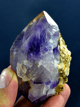 Deep purple amethyst crystal specimen with a small chip from Pakistan.